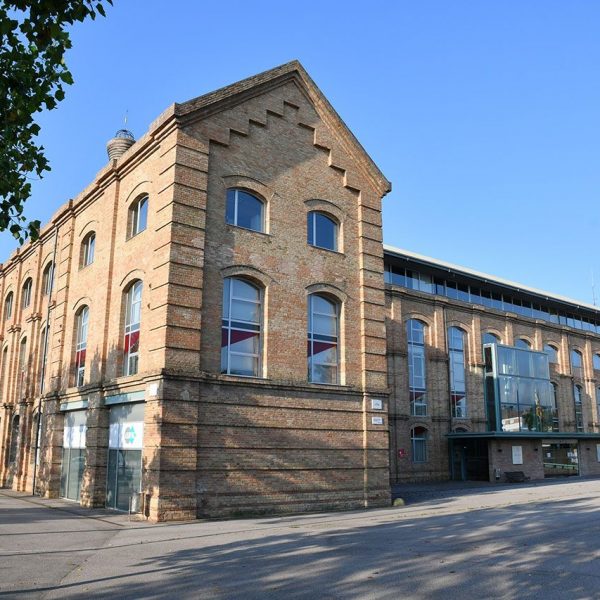 Vic.- Fàbrica de Sucre, S. XIX d'estil modernista en forma de U, destaca per la seva xemeneia cònica. Actualment acull diverses institucions i activitats culturals (6/2020)