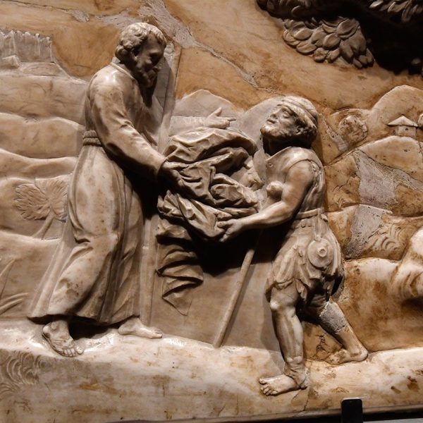 Manresa.- Cova de Sant Ignasi – Plafó anònim d’alabastre del S. XVIII – Escena de Sant Ignasi a Montserrat donant els seus vestits a un pobre (Museu de Manresa) (4/2024)